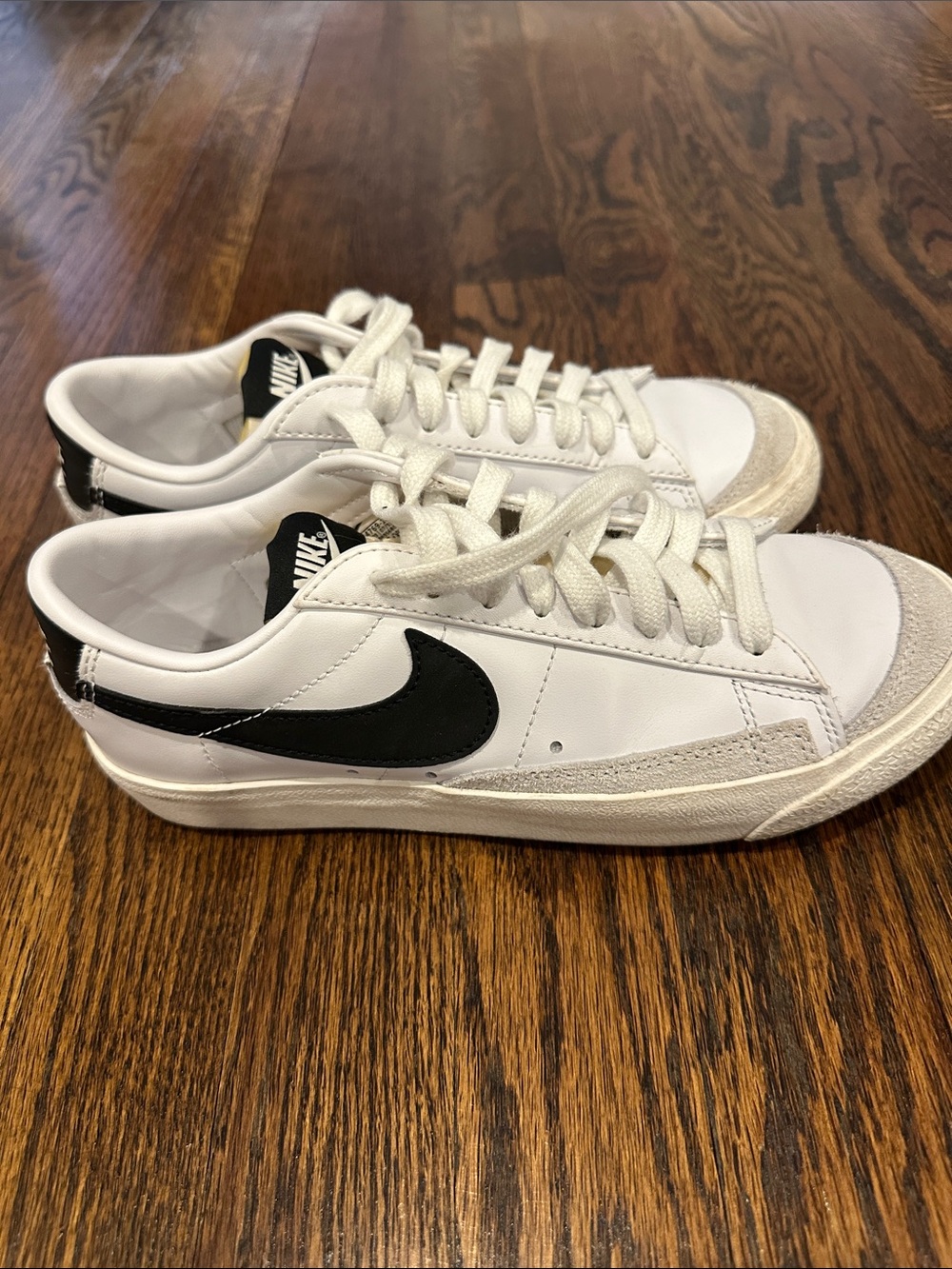 Nike Kids White Sneakers with Black Swoosh and Suede Accents